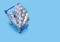 Pills in cart. Shopping cart loaded with pills on blue background. The concept of medicine and the sale of drugs. Copy space Royalty Free Stock Photo