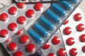 Blisters with red and blue tablets. On a light background. Close-up Royalty Free Stock Photo