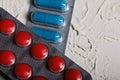 Blisters with red and blue tablets. On a light background. Close-up Royalty Free Stock Photo