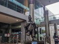 Bung Karno statue sitting holding a book in the Bung Karno library