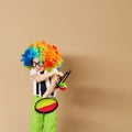 Blithesome children. Portrait of happy clown boy wearing large n Royalty Free Stock Photo