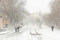 Blizzard, mist and snowfall in city, cars on sleet road, poor visibility, winter bad weather Royalty Free Stock Photo