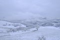 Blizzard in the mountains. Snowy hills, mountains, nature, horizon. Natural background. Appennino-Tosco-emiliano