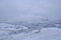 Blizzard in the mountains. Snowy hills, mountains, nature, horizon. Natural background. Appennino Tosco-emiliano