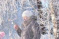 The blizzard, strong wind, blurred view of woman walking in winter blizzard