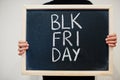 Blk fri day written on blackboard. Black friday concept. Boy hold board