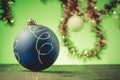Bllue Christmas ball on a green light background Royalty Free Stock Photo