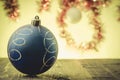 Bllue Christmas ball on a yellow light background Royalty Free Stock Photo