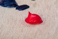 A Blob/Dab of Red Acrylic Paint on a wood Artist`s palette ready to be used by a working artist Royalty Free Stock Photo