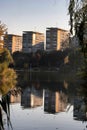 Block of flats with reflection in Titan lake Royalty Free Stock Photo