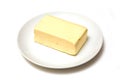 Block of butter on plate Royalty Free Stock Photo