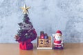 Block calendar date December 25 calendar and Christmas decoration - Santa Clause, tree and gift on wooden table. Christmas and Royalty Free Stock Photo