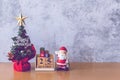 Block calendar date December 25 calendar and Christmas decoration - Santa Clause, tree and gift on wooden table. Christmas and Royalty Free Stock Photo