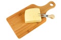 Block of cheese on cutting board with a knife, isolated on white background Royalty Free Stock Photo