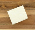 Block of feta cheese on a wood cheese board Royalty Free Stock Photo