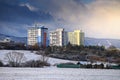 Block of flats in winter landscape, blue background, dark sky Royalty Free Stock Photo