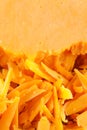 Block of yellow cheddar cheese , some grated . Royalty Free Stock Photo