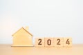2024 block with house model. real estate, Home loan, tax, investment, financial, savings and New Year Resolution concepts Royalty Free Stock Photo