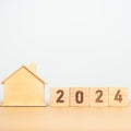 2024 block with house model. real estate, Home loan, tax, investment, financial, savings and New Year Resolution concepts Royalty Free Stock Photo