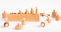 Block with incorrectly placed Montessori knobbed cylinders. Error in puzzle assembly. Disorder, confusion concept. Kids