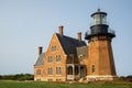 A landscape view of Block Island Southeast Light, a lighthouse located on