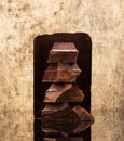 Block and pieces dark chocolate Royalty Free Stock Photo