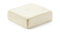 Block of tofu with a smooth, creamy texture and pale cream color, shaped into a