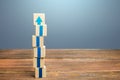 Block tower with blue arrows. Growth, development progress. Road map agreement concept. Career promotion step by step. Education, Royalty Free Stock Photo