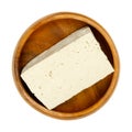 Block of white tofu, bean curd made of soy milk, in a wooden bowl Royalty Free Stock Photo