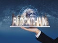 Blockchain business and technology, Hand holding digital tablet with buildings and blockchain technology. Element of this image ar Royalty Free Stock Photo