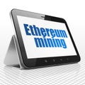 Blockchain concept: Tablet Computer with Ethereum Mining on display Royalty Free Stock Photo