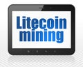 Blockchain concept: Tablet Pc Computer with Litecoin Mining on display