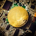 Blockchain technology bitcoin mining concept. Bitcoin golden coin on computer circuit board. banner copy space Royalty Free Stock Photo