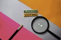 Blockchain Voting text on sticky notes with color office desk concept Royalty Free Stock Photo