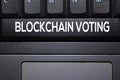 Blockchain Voting write on keyboard isolated on laptop background