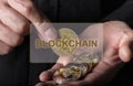 Blockchain word over photo with bitcoin and other cryptocurrency coins