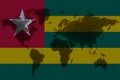 Blockchain world map on the background of the flag of togo and cracks. togo cryptocurrency concept