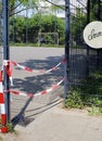 Blocked, closed public playground, football ground, coronavirus lockdown