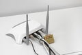 Blocked internet access concept - wifi router with padlock Royalty Free Stock Photo