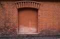 Blocked old window, brick wall.