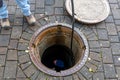 Blocked pipe. Sewer inspection with camera. Sewer cleaning company worker at work in a manhole Royalty Free Stock Photo