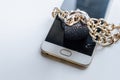 Blocked smartphone. The smartphone is chained and locked, as a symbol of private access to software