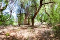 A blockhouse hidden by trees. Royalty Free Stock Photo