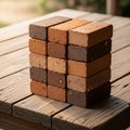 The blocks are arranged in a four by four grid on a wooden table Royalty Free Stock Photo