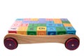 Blocks in back of wooden trolley isolated on whit Royalty Free Stock Photo