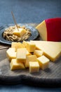 Blocks of Dutch red ball Edam cheese and mustard Royalty Free Stock Photo