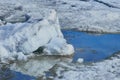 Blocks of ice on the river. Reflections in the water. Royalty Free Stock Photo