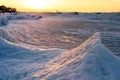 Blocks of ice on the seashore at sunset Royalty Free Stock Photo