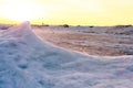 Blocks of ice on the seashore at sunset Royalty Free Stock Photo