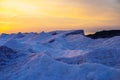 Blocks of ice on the seashore at sunset Royalty Free Stock Photo